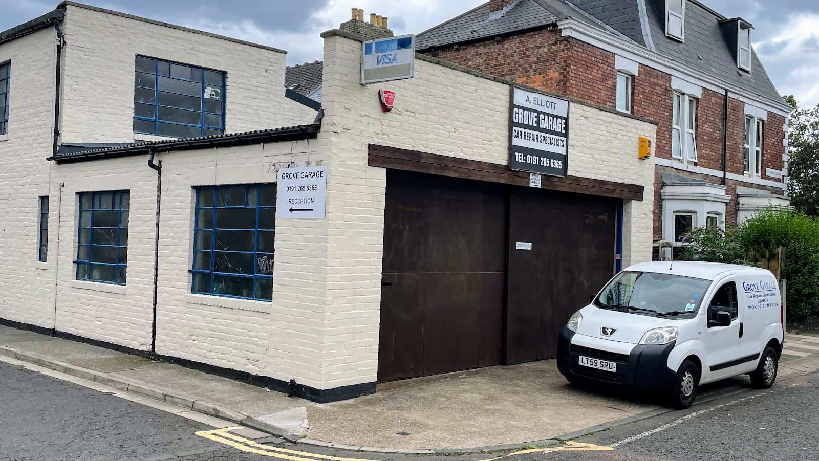 Grove Garage on Heaton Hall Road, Heaton: the workshop frontage with the Grove Garage van